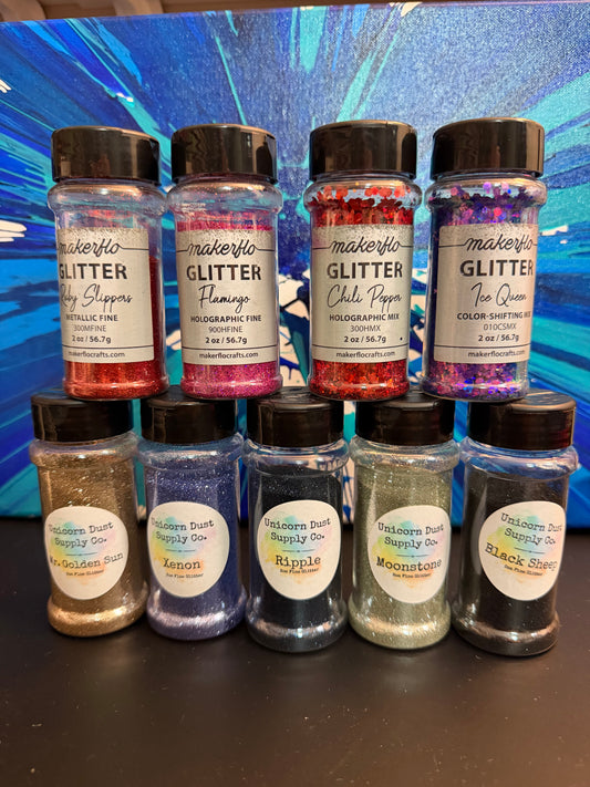 Set of Nine bottles of glitter ￼